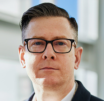 Alexander Hughes vezetői fotója, egy kriptovaluta kereskedelmi cég vezérigazgatója